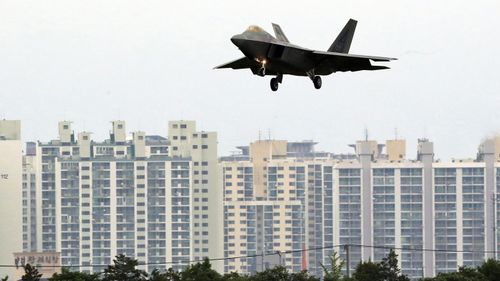 A US F-22 Raptor stealth fighter jet lands as South Korea and the United States conduct the Max Thunder joint military exercise at an air base in Gwangju, South Korea. (AAP)