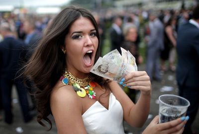 This punter shows off her winnings. (Getty)