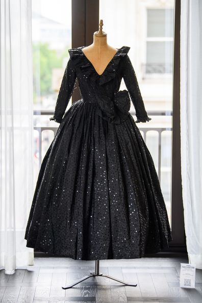 LONDON, ENGLAND - JUNE 03: Black sequin dress designed by David and Elizabeth Emanuel is displayed ahead of the largest collection of Diana, Princess of Wales clothing to be auctioned at the Peninsula London on June 03, 2025 in London, England. The collection will move to Peninsula Hotel Beverley Hills for auction. (Photo by Joe Maher/Getty Images)