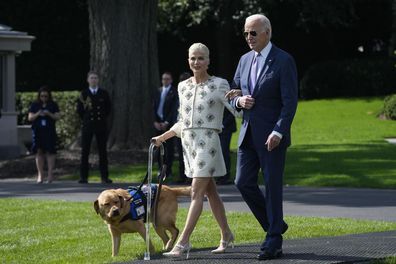President Joe Biden with actress Selma Blair and Blair's service dog Scout