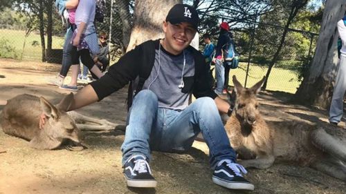 Mr Velasco, who turned 19 days prior to the crash, shared a photo of himself with kangaroos while in Australia. (Twitter)