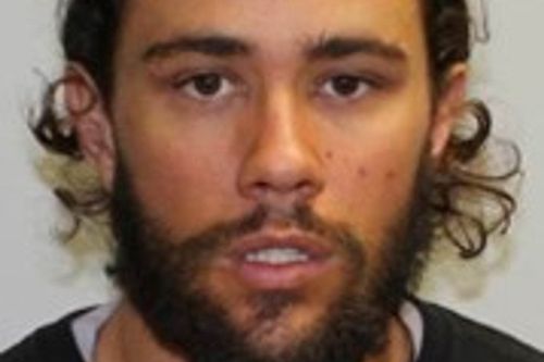 Pledger is described as approximately 170cm tall with brown hair and tanned complexion.
