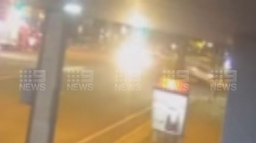 Security vision has captured the moment two utes collided at an Adelaide intersection flipping one of them on its side, metres away from another crash.
