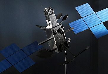 What are the names of the two communications satellites operated by NBN Co?