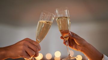 Couple cheers champagne celebration 