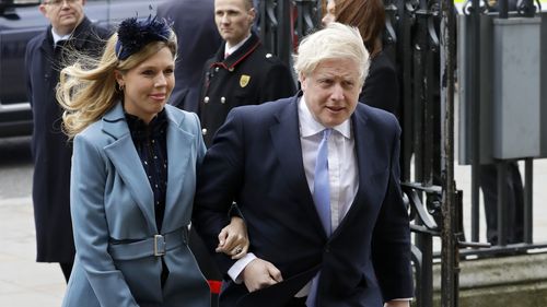 In this Monday, March 9, 2020, file photo Britain's Prime Minister Boris Johnson and his partner Carrie Symonds arrive to attend the annual Commonwealth Day service at Westminster Abbey in London.