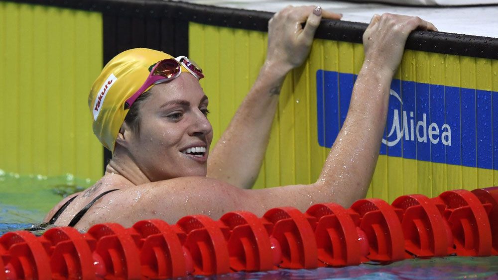 Aussie backstroker Emily Seebohm defies unwanted distraction to launch dual world titles defence