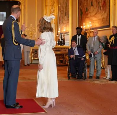 Kate Garraway receives MBE from Prince William as  her husband Derek Draper and her parents Gordon and Marilyn Garraway watch on.