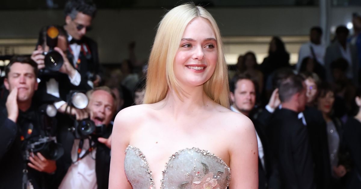 Explosion of camera flashes as 'Queen of Cannes' arrives