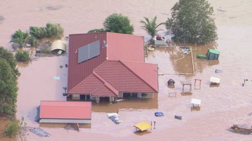 Images from the 9News chopper show houses inundated at Woodburn, near Ballina.