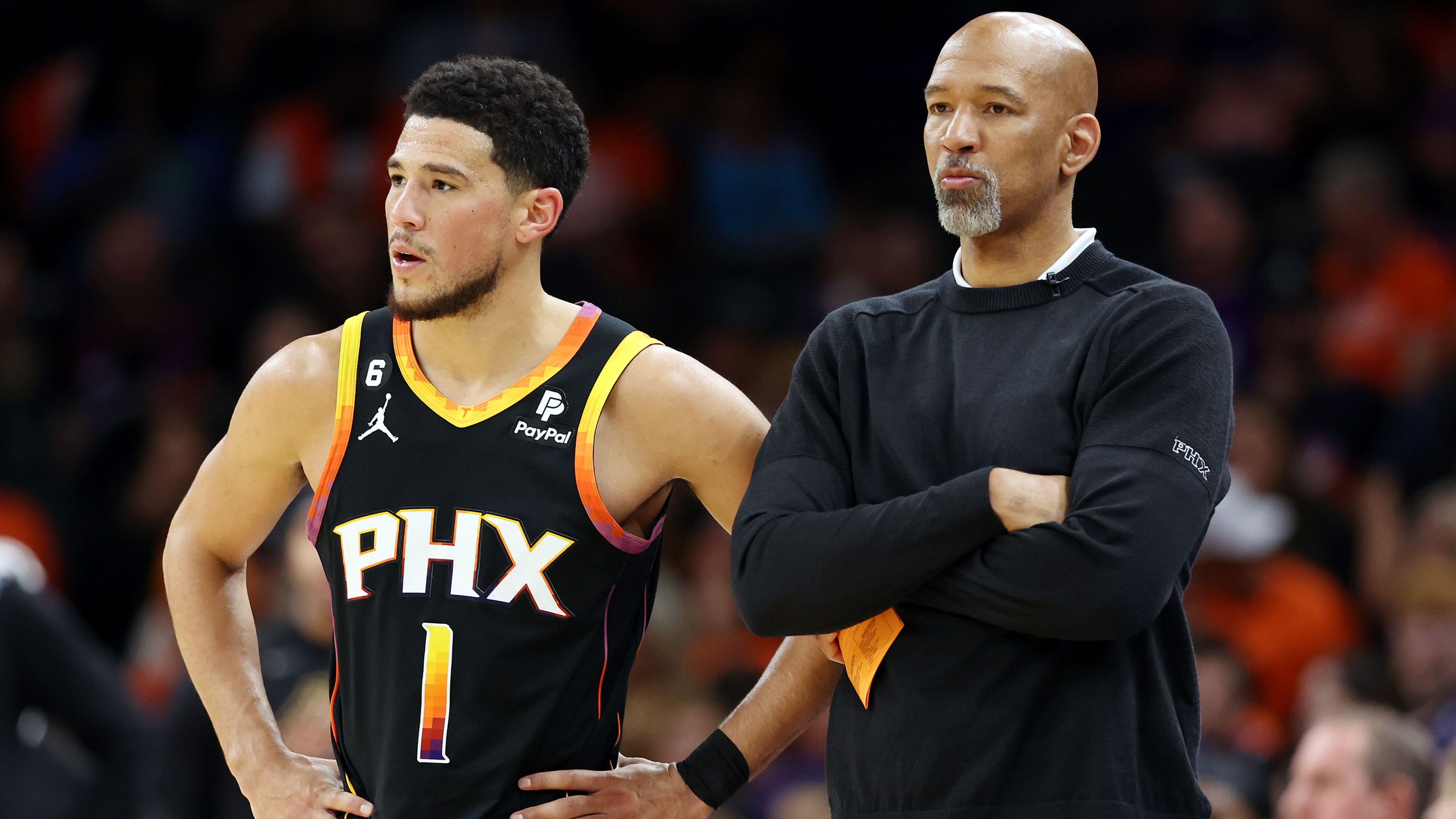 Devin Booker #1 stands with head coach Monty Williams of the Phoenix Suns during the second quarter against the Denver Nuggets in game six of the Western Conference Semifinal Playoffs at Footprint Center on May 11, 2023 in Phoenix, Arizona.