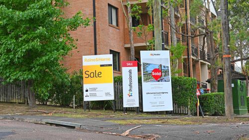 A block of units in Gosford, New South Wales Australia with three for sale signs out the front.
