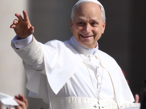 Pope Leo XIV waves as he arrives ahead of the Inauguration Mass of Pope Leo XIV in St Peter's Square.