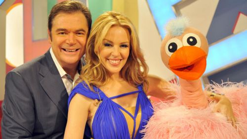 Daryl Somers with Kyle Minogue and Ossie Ostrich during a reunion show in 2010. (AAP)
