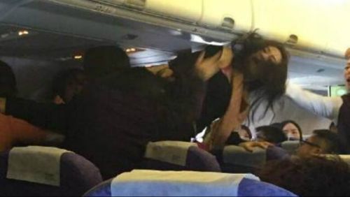 Passengers questioned after fight breaks out on Air Asia flight