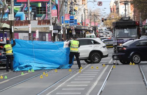 The 27-year-old cyclist was travelling in a bike lane in South Yarra's Chapel Street when she was struck by a white Mercedes-Benz and knocked into the path of another car on Sunday.