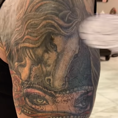 Tattoo artist shows process of covering up Sylvester Stallone's second tattoo of Jeniffer Flavin.