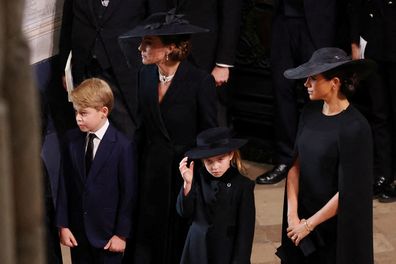 Britain's King Charles and Queen Camilla, Catherine, Princess of Wales, Meghan, Duchess of Sussex  Prince George and Princess Charlotte attend, on the day of the state funeral and burial of Britain's Queen Elizabeth, at Westminster Abbey in London, Britain, September 19, 2022. 