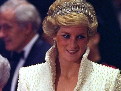 FILE - In this 1989 file photo, Diana, Princess of Wales smiles during an official visit to Hong Kong. This dress is part of an exhibition of 25 dresses and outfits worn by Diana entitled "Diana: Her Fashion Story" at Kensington Palace in London, opening on Friday, Feb. 24, 2017. (AP Photo/Liu Heung Shing, file)