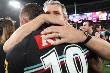 Ivan Cleary embraces James Fisher-Harris after the Panthers won the 2023 NRL grand final.
