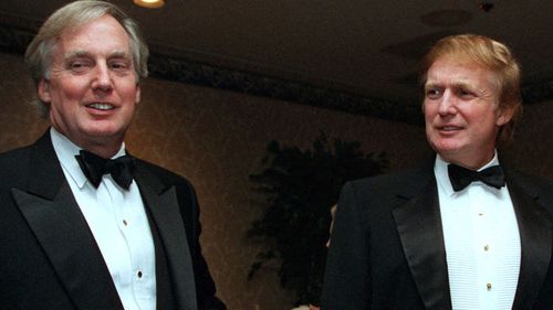 Robert Trump, left, joins real estate developer and presidential hopeful Donald Trump at an event in New York (Photo: Nov. 3, 1999)
