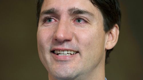 Canadian Prime Minister Trudeau pays tearful tribute to Downie. (AP)