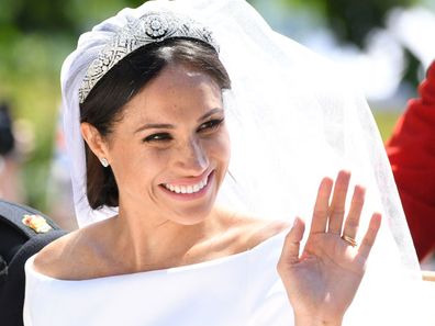 Meghan Markle rides a horse-drawn carriage, after their wedding ceremony at St. George's Chapel in Windsor Castle in Windsor, near London, England, Saturday, May 19, 2018