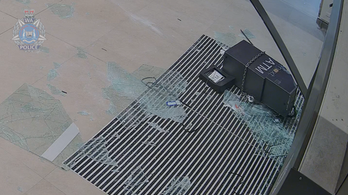 Cameras captured the moment thieves rammed through the doors of a shopping center in the dead of night and stole an ATM.