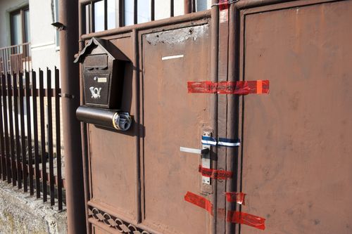 Police seals are seen on the gate of the residence of murdered Slovak journalist Jan Kuciak in Velka Maca, Slovakia, on February 28, 2018. Photo/Martin Mikula (CTK via AP Images)