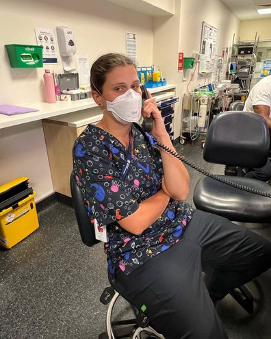 AFLW player Nell Morris-Dalton at work as a nurse in her scrubs.