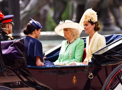 Harry and Meghan with Camilla and Kate in carriage