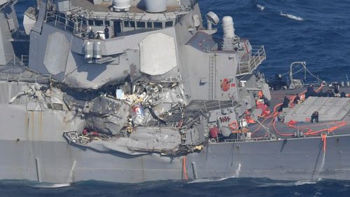 The starboard side of the US Navy destroyer was heavily damaged. (AAP)
