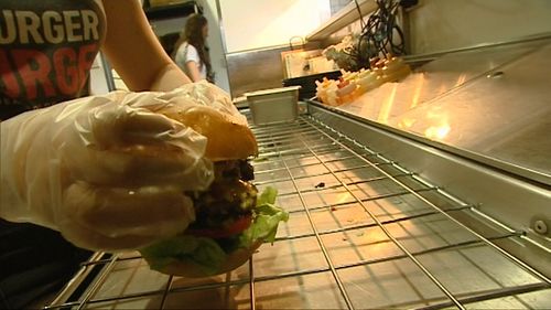 The burger us so hot it has to be cooked using gloves and goggles. (9NEWS)