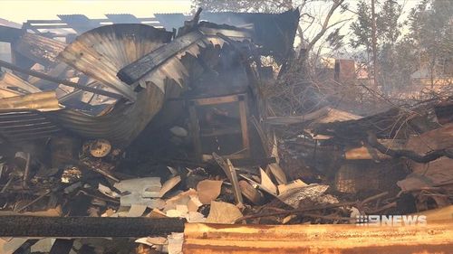 The charred shell of a backyard shed was all that remained after an out of control bushfire tore through a New South Wales property.