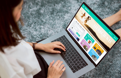 Woman booking a holiday on a computer / laptop