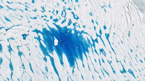 A handout photo made available by the National Aeronautics and Space Administration (NASA) of a satellite image showing ponds of meltwater on the George VI ice shelf, Antrarctica, 19 January 2020 (issued 23 January 2020). Summer warmth can turn ice into water also in Antarctica. At the peak of the 2019-2020 melt season, jewel-toned ponds of meltwater spanned a vast area on the George VI ice shelf -- a huge slab of floating glacier ice attached to the western side of the Antarctic Peninsula.