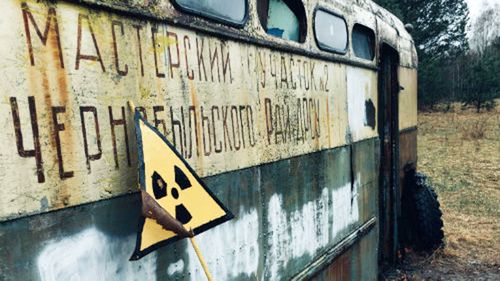 An abandoned bus belonging to the Chernobyl Road Repairing and Building Service.