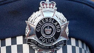 Queensland Police badge on cap (Getty)