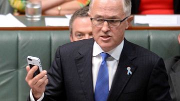 Communications Minister Malcolm Turnbull denies dobbing in sacked SBS journalist over Anzac tweet. (AAP)