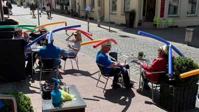 Diners at the Cafe Rothe in Schwerin were asked to wear pool noodle hats for social distancing.