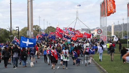 Thousands of anti-vaccine protesters marching in Canberra.