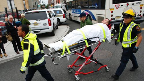 An injured person is taken to hospital. (AFP)