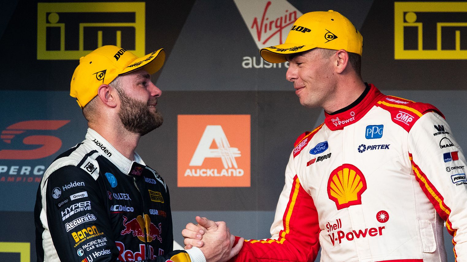 Shane van Gisbergen (left) shakes hands with Scott Mclaughlin in 2019.