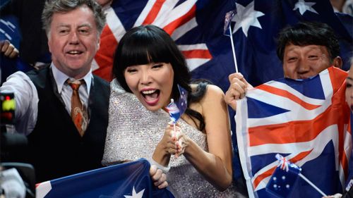 Dami Im cheers in the Green Room during the Grand Final. (AAP)