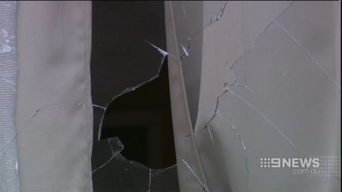 At least one of the petrol bombs smashed through a window. (9NEWS)