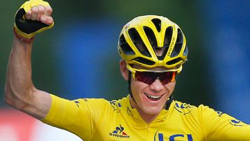2016 Tour de France winner Chris Froome of Britain celebrates as he crosses the finish line of the twenty-first stage of the Tour de France. (AAP)