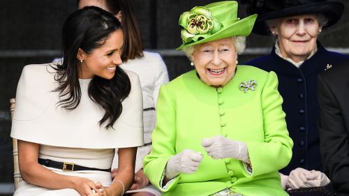 They laughed and shared stories during a performance by local children. Picture: Getty