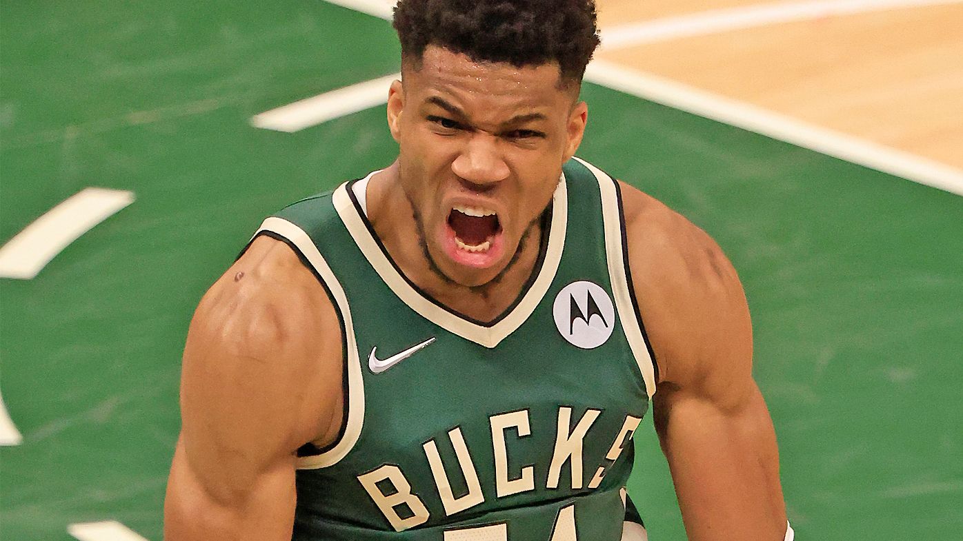 Giannis Antetokounmpo #34 of the Milwaukee Bucks celebrates during the second half in Game Three