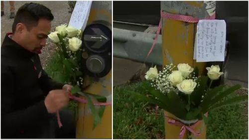 A local man is pictured leaving flowers for the teenage girl. (9NEWS)