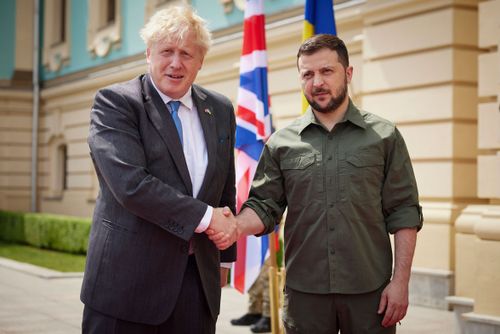 Ukrainian President Volodymyr Zelenskyy, right, and Britain's Prime Minister Boris Johnson, pose for a photo during their meeting in downtown Kyiv, Ukraine, Friday, June 17, 2022